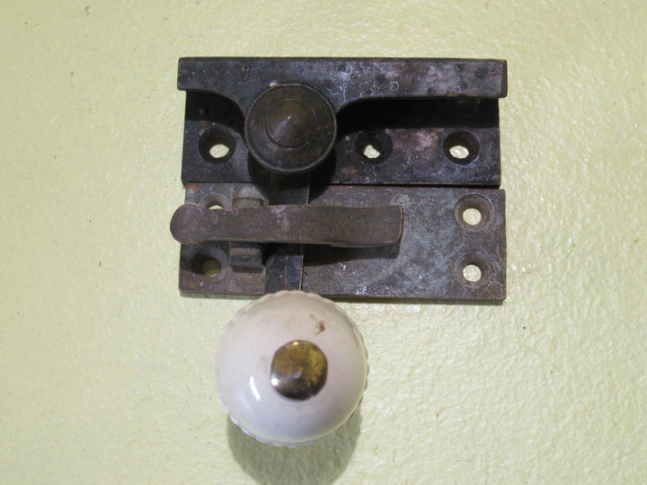 Brass and Porcelain Fitch Fastener   70L x 25W