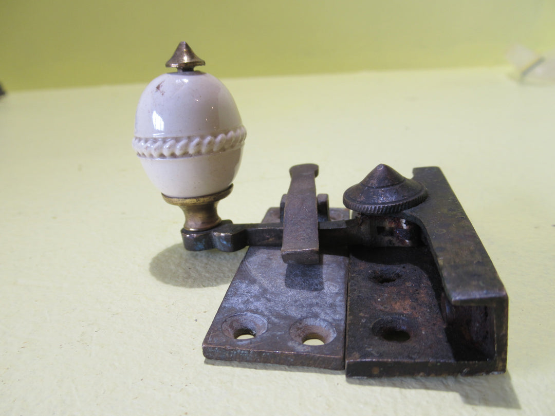 Brass and Porcelain Fitch Fastener   70L x 25W