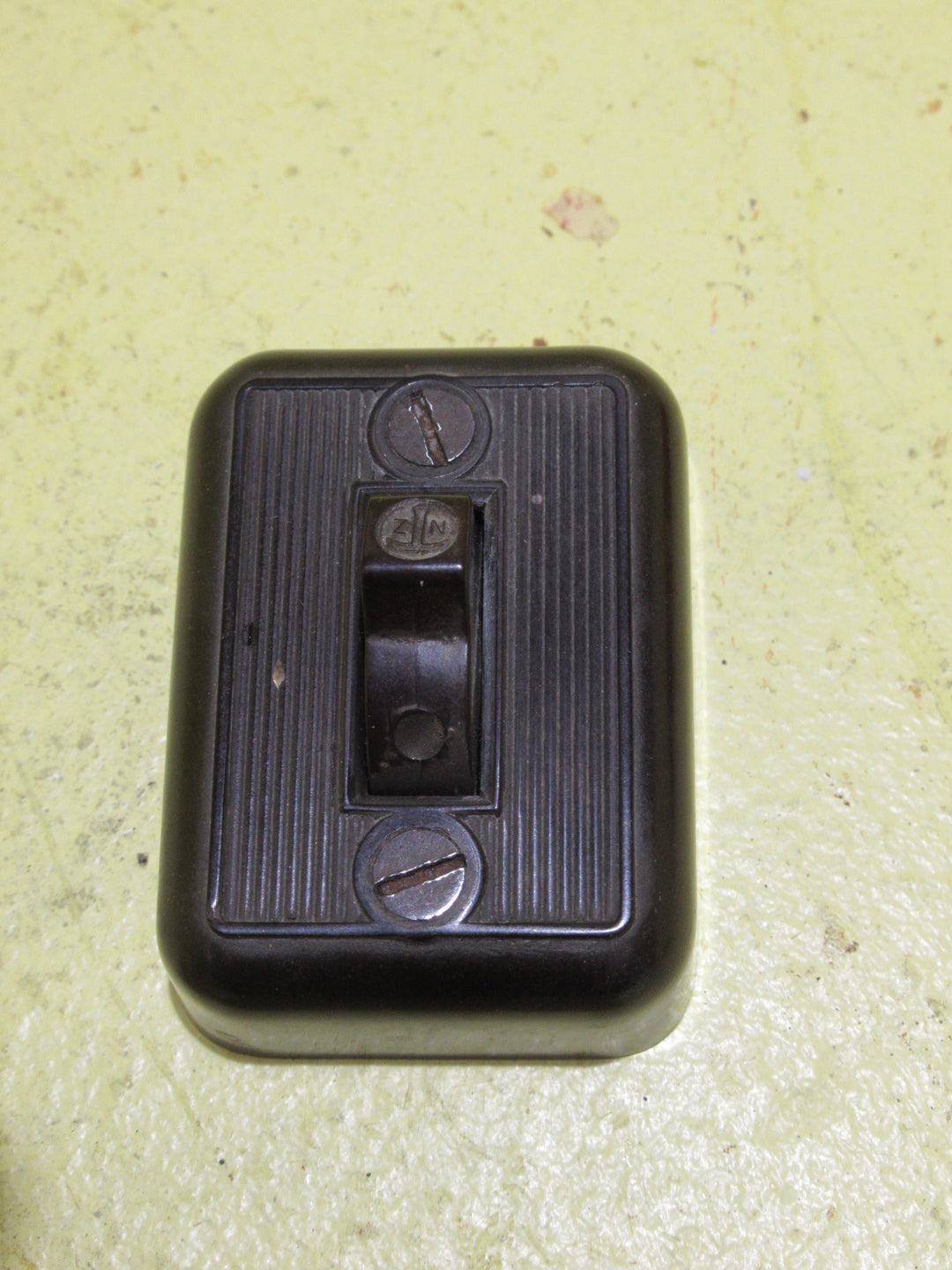 Small Brown Bakelite Rectangle Ribbed Light Switch 58H x 45W x 20D