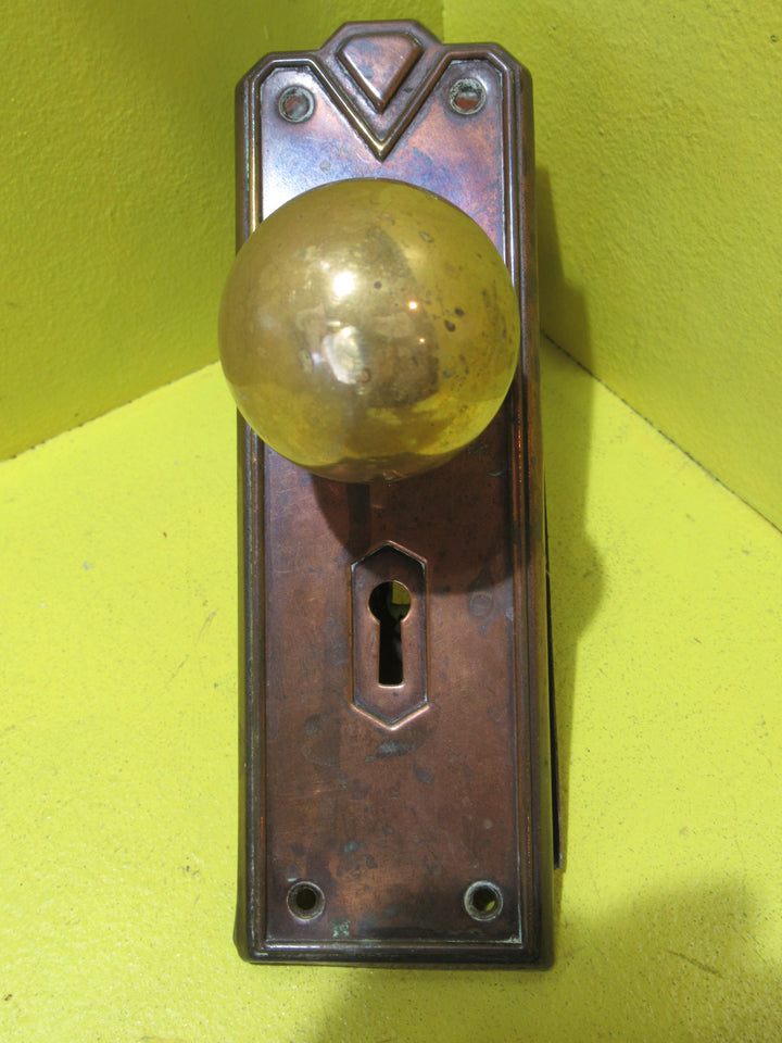 Art Deco Copper Plate with Raised Edge & Diamond Detail at the Top completed with Brass Ball Handles.   Plate 187L x 61W  Handle 45 Dia x 60H