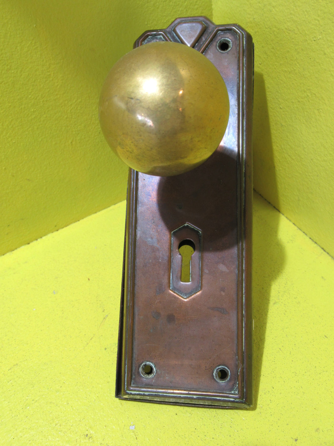 Art Deco Copper Plate with Raised Edge & Diamond Detail at the Top completed with Brass Ball Handles.   Plate 187L x 61W  Handle 45 Dia x 60H