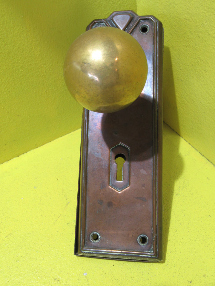 Art Deco Copper Plate with Raised Edge & Diamond Detail at the Top completed with Brass Ball Handles.   Plate 187L x 61W  Handle 45 Dia x 60H