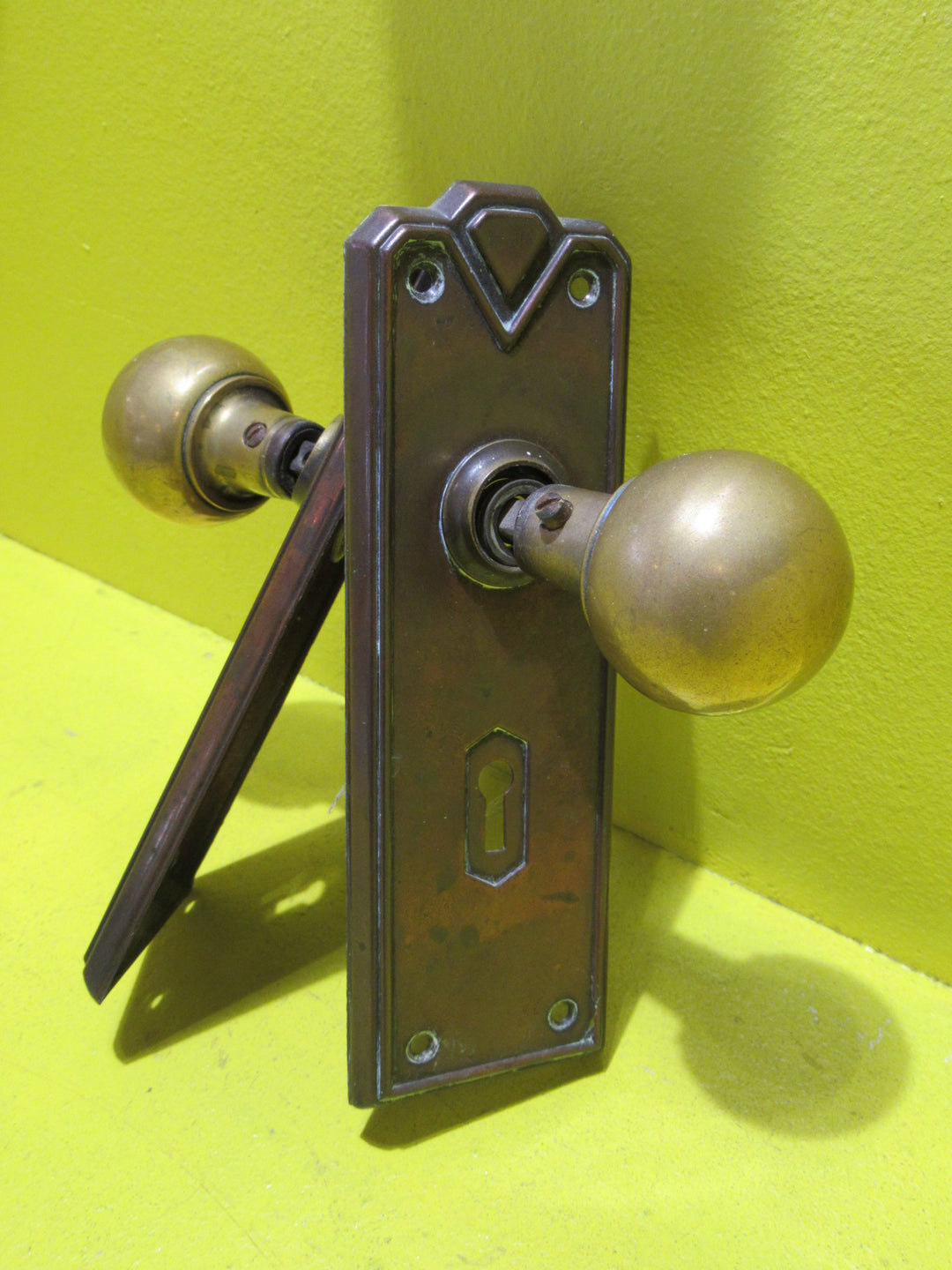 Art Deco Copper Plate with Raised Edge & Diamond Detail at the Top completed with Brass Ball Handles.   Plate 187L x 61W  Handle 45 Dia x 60H