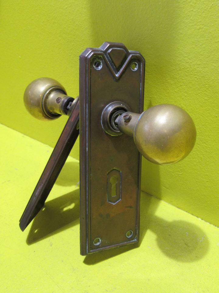Art Deco Copper Plate with Raised Edge & Diamond Detail at the Top completed with Brass Ball Handles.   Plate 187L x 61W  Handle 45 Dia x 60H